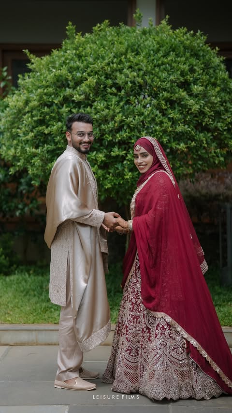 happily married couples posing by holding their hands, perfectly captured by best wedding photographer in calicut